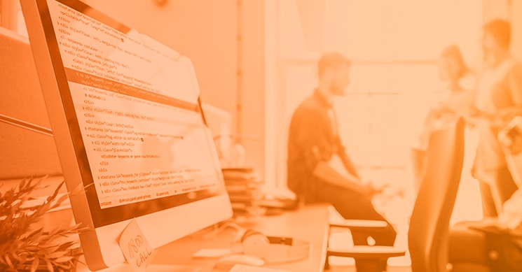 people standing around computer with app with single-factor authentication