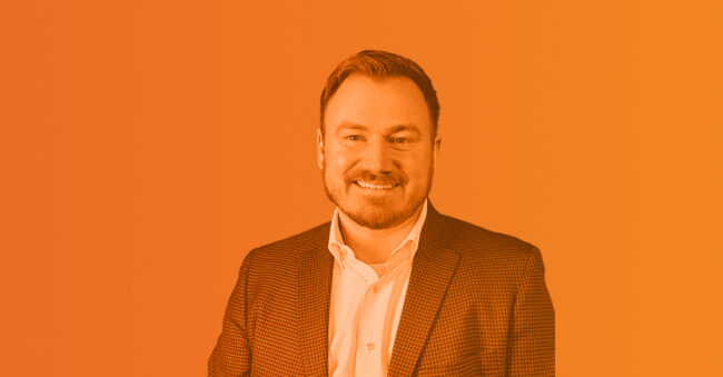 Headshot of Drew Boeke with orange overlay