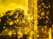 yellow monochrome image of a person welding with sparks to represent CMMC final rule
