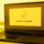 monotone yellow image of a laptop showing a software stating "backup complete," representing IDrive Backup CVE-2026-1995